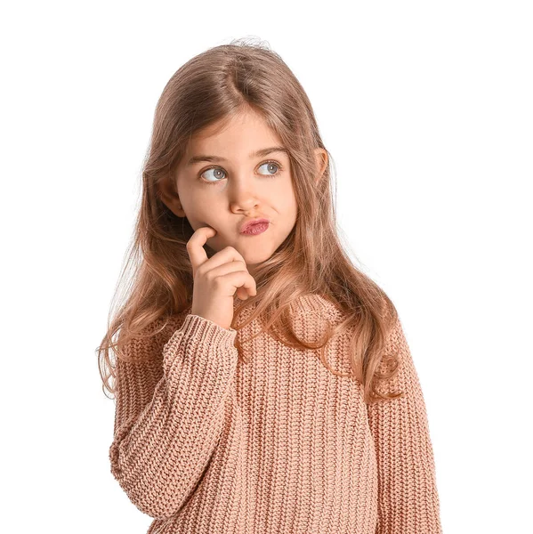 Thoughtful little girl in winter clothes on white background — Stock Photo, Image