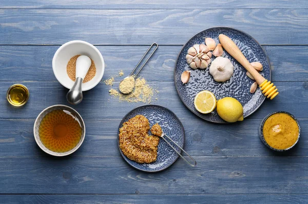 Ingredients for honey mustard sauce on wooden background