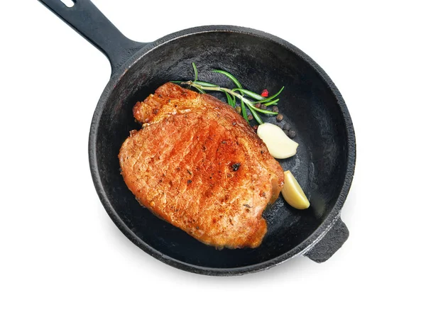 Frying pan with cooked pork steak on white background — Stock Photo, Image