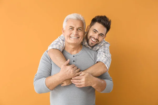 Young Man His Father Color Background — Stock Photo, Image