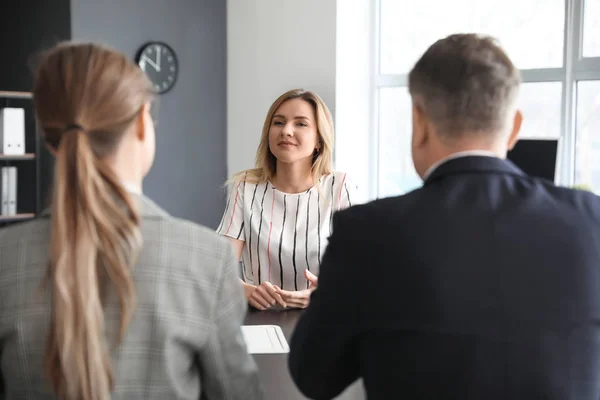 Human resources commission interviewing woman in office