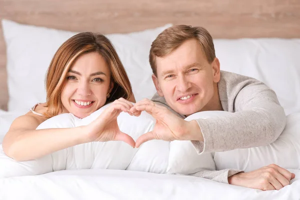 Beautiful Couple Holding Hands Shape Heart Bedroom — Stock Photo, Image