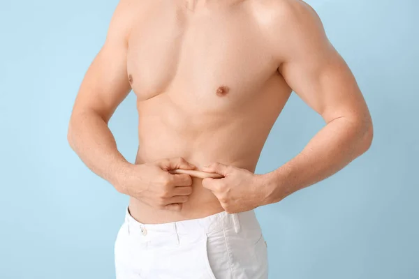 Young Man Touching His Belly Fat Color Background Plastic Surgery — Stock Photo, Image