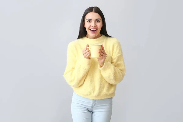 Beautiful Young Woman Warm Sweater Drinking Tea Light Background — Stock Photo, Image