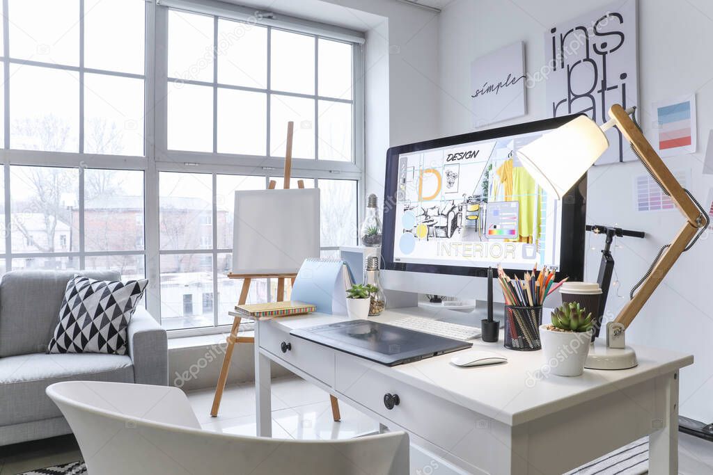Comfortable workplace of interior designer in office