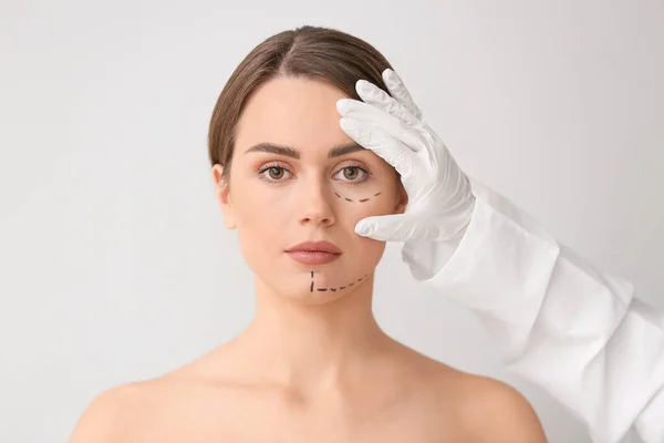 Plastic Surgeon Touching Face Young Woman Light Background — Stock Photo, Image