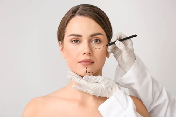 Plastic Surgeon Applying Marking Female Face Light Background — Stock Photo, Image