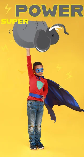 Strong Little Superhero Holding Drawn Elephant Color Background — Stockfoto