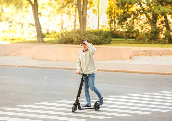 Young Man Riding Kick Scooter Outdoors — Stock Photo, Image