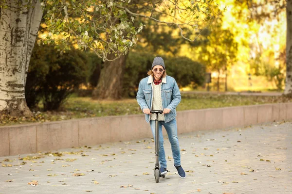 Young Man Riding Kick Scooter Outdoors — Stock Photo, Image