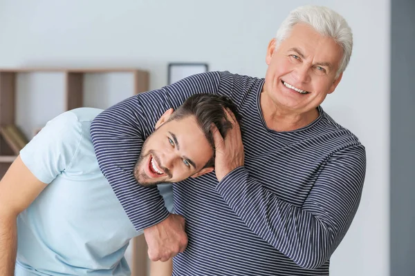 Young Man His Father Having Fun Home — Stockfoto