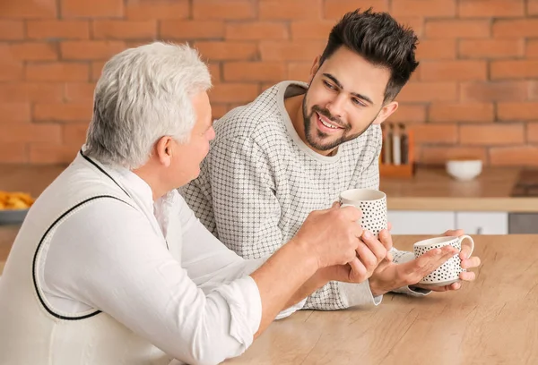 Young Man His Father Drinking Tea Kitchen — Stockfoto