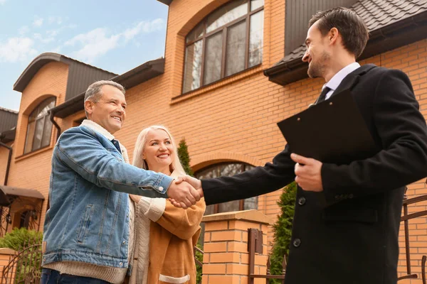 Male Real Estate Agent Shaking Hands Mature Couple House Outdoors — Stock Photo, Image