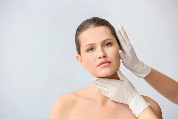 Plastic Surgeon Touching Face Young Woman Light Background — Stock Photo, Image