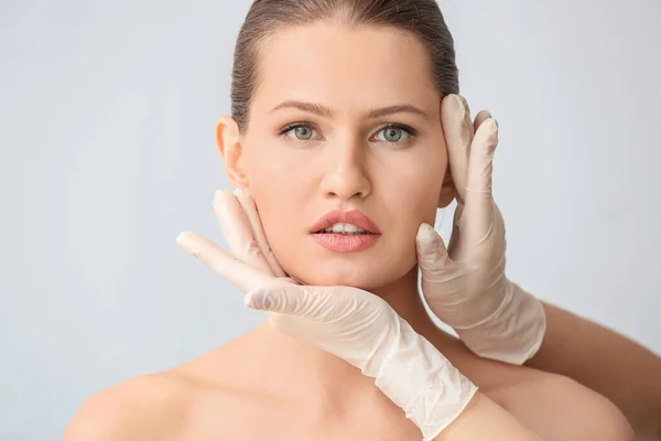 Plastic Surgeon Touching Face Young Woman Light Background — Stock Photo, Image