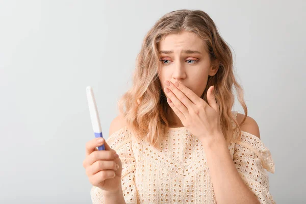 Sad Young Woman Pregnancy Test Light Background — Stock Photo, Image