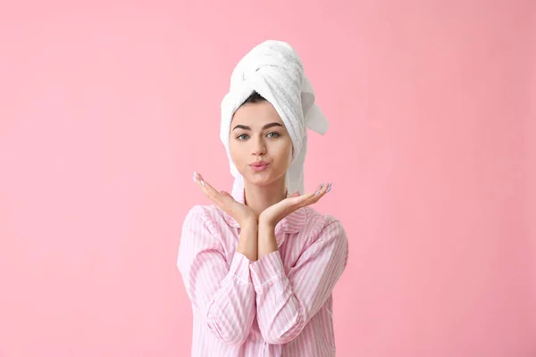Portrait of woman after shower on color background