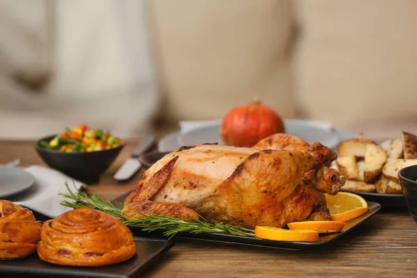 Tasty baked turkey for Thanksgiving day on table