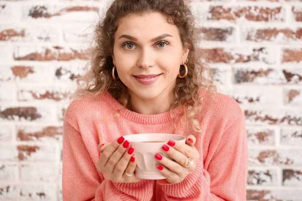 Beautiful Young Woman Warm Sweater Drinking Tea Brick Background — Stock Photo, Image