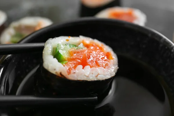 Dipping Tasty Sushi Roll Soy Sauce Closeup — Stock Photo, Image