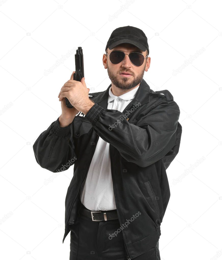 Male police officer with gun on white background