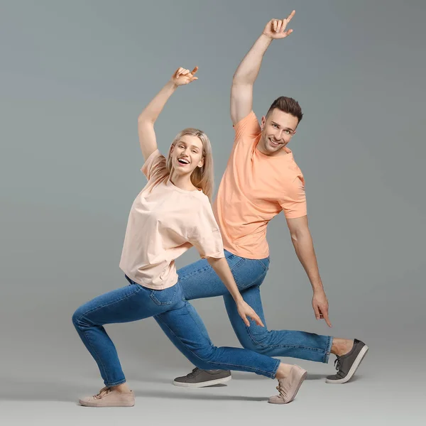 Happy Dancing Young Couple Grey Background — Stock Photo, Image