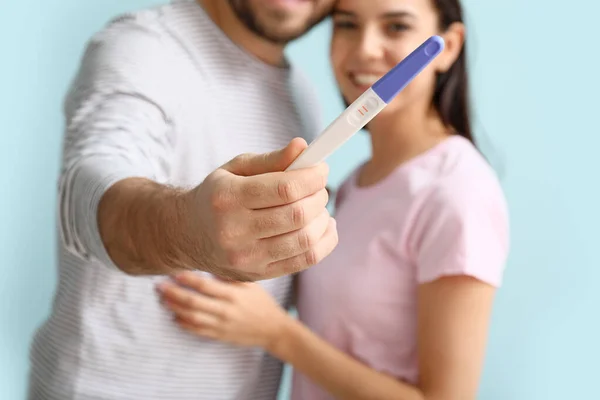 Happy Young Couple Pregnancy Test Color Background Closeup — Stock Photo, Image