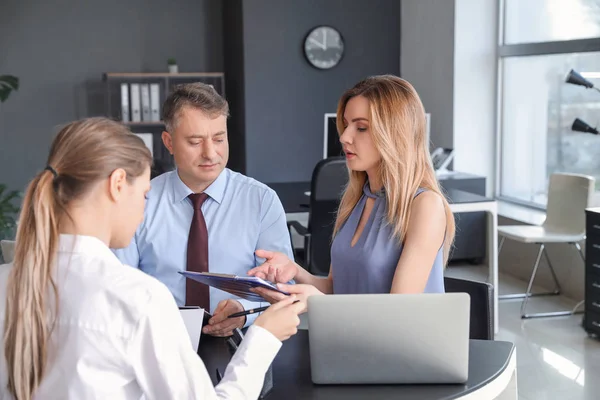 Human resources commission interviewing woman in office