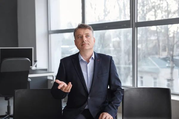 Mature man during job interview in office