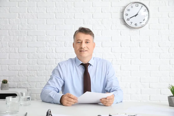 Mature man during job interview in office