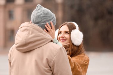 Portrait of happy young couple on romantic date outdoors
