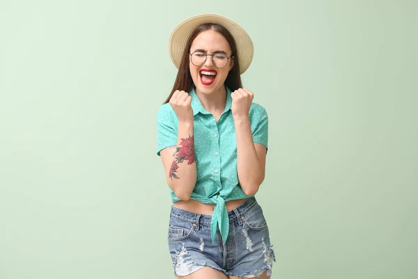 Happy young woman on color background