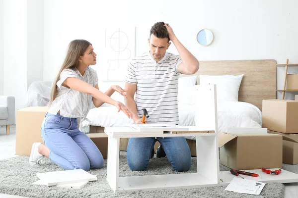 Emotional Couple Assembling Furniture Home — Stock Photo, Image