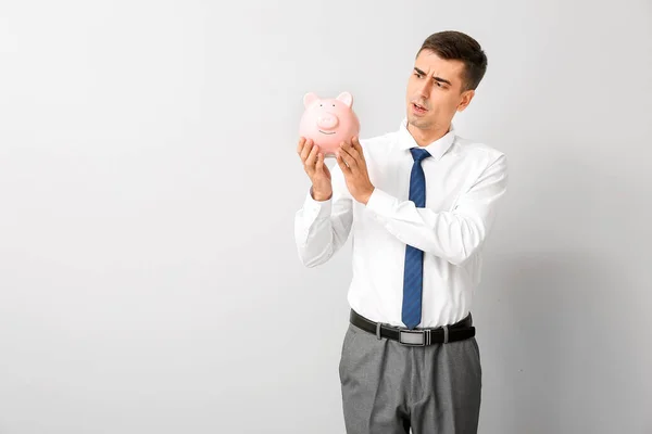 Worried Businessman Piggy Bank Light Background — Stock Photo, Image