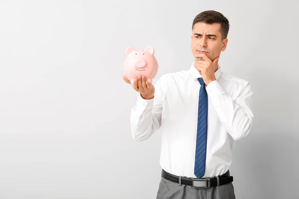 Thoughtful Businessman Piggy Bank Light Background — Stock Photo, Image