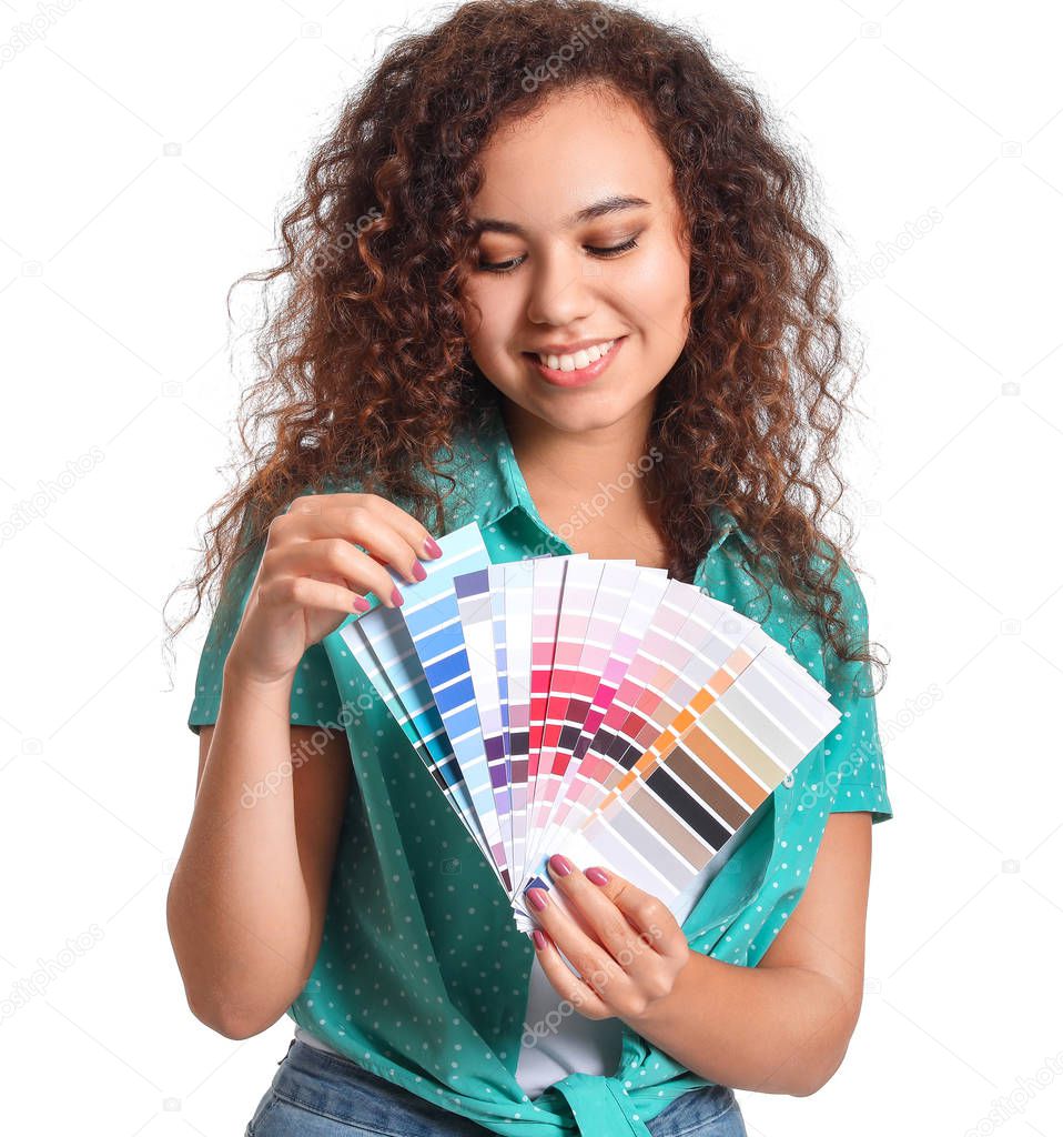 African-American woman with color palettes on white background