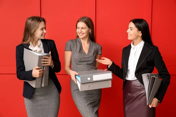 Beautiful Young Businesswomen Folders Color Background — Stock Photo, Image