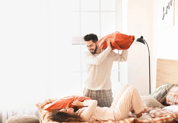 Happy Young Couple Fighting Pillows Bedroom — Stock Photo, Image