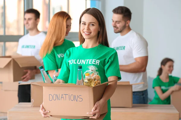 Team Volunteers Products Indoors — Stock Photo, Image