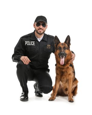 Male police officer with dog on white background