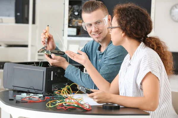 Electronic technicians working in service center