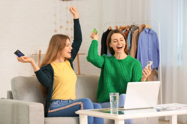 stock image Young women using laptop for online shopping at home