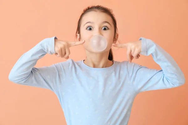 Cute Little Girl Chewing Gum Color Background — Stock Photo, Image