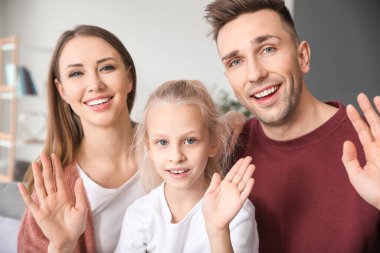 Portrait of family video chatting at home