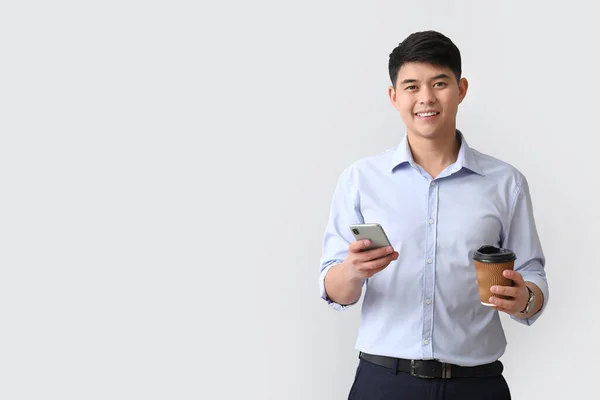 Young Asian Businessman Mobile Phone Coffee Light Background — Stock Photo, Image