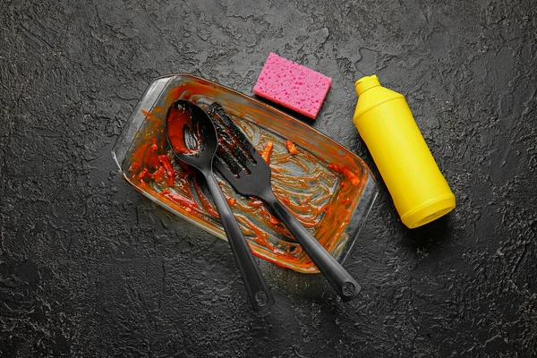 Dirty Baking Dish Kitchen Utensils Detergent Sponge Dark Background — Stock Photo, Image