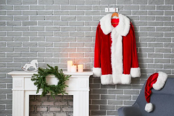 Santa Claus Costume Hanging Brick Wall Fireplace Room — Stock Photo, Image