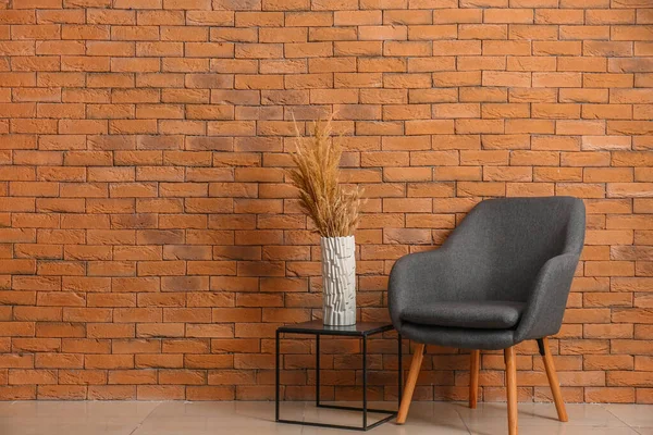 Soft Armchair Table Vase Brick Wall Room — Stock Photo, Image