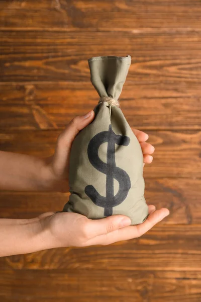 Female Hands Holding Bag Money Wooden Background — Stock Photo, Image