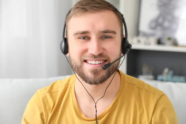 Young man using video chat at home